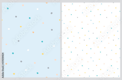 Cute Hand Drawn Abstract Irregular Polka Dots Vector Pattern Set. Colorful Tiny Brush Dots Isolated on a Pastel Blue and White Background. Simple Bright Dotted Vector Print. 