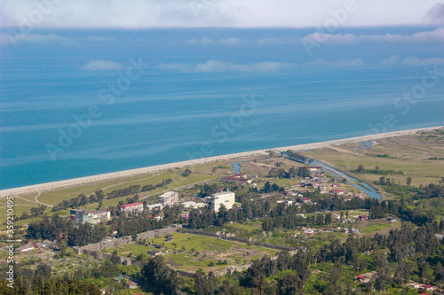 View of Gonio Apsaros Fortress  Black Sea beach and surrounding apartment buildings. Georgia  Gonio
