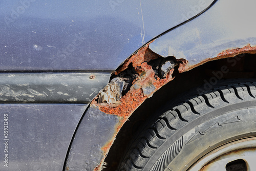 Rusty old car damaged by corrosion photo