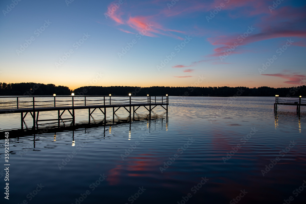 Obraz premium reflection of pink clouds in a river at sunrise