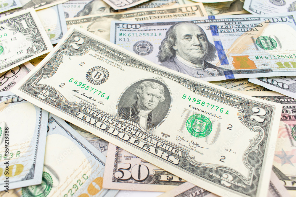 Dolar. American money background texture bills of 2 american dollars. two dollar bill on dollar money background. Dolar. American money background texture bills of 2 american dollars. two dollar bill on dollar money background.