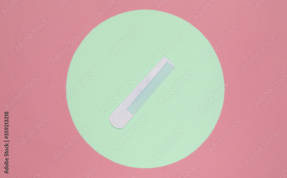 White Hair combon on blue pastel background with green pastel circle. Creative minimalistic beauty and fashion still life. Top view White Hair combon on blue pastel background with green pastel circle. Creative minimalistic beauty and fashion still life. Top view