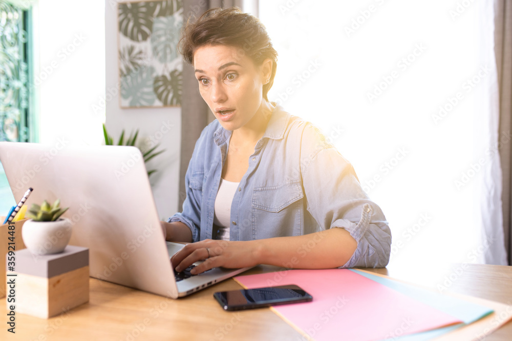 woman working on a computer at home