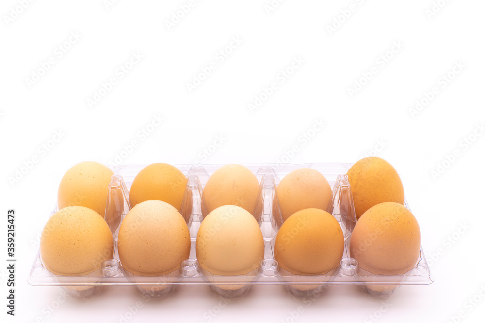 Organic eggs in transparent package, on white background. Freshly packaged organic egg packs Organic eggs in transparent package, on white background. Freshly packaged organic egg packs