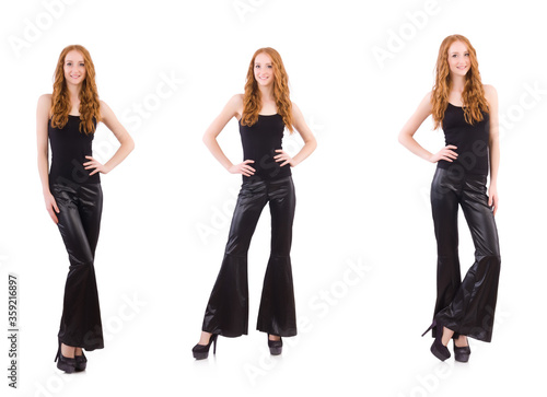 Redhead woman in black bell bottom pants on white