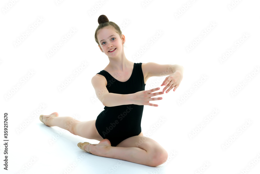 The gymnast perform an acrobatic element on the floor. The gymnast perform an acrobatic element on the floor.