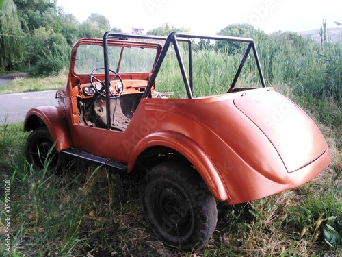 Abandoned old car on the route