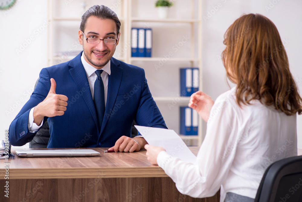 Business meeting between businessman and businesswoman Business meeting between businessman and businesswoman