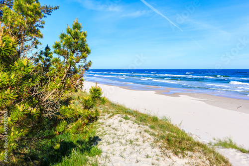 Fototapeta Naklejka Na Ścianę i Meble -  Beautiful white sand beach and blue sea near Kolobrzeg, Baltic Sea coast, Poland