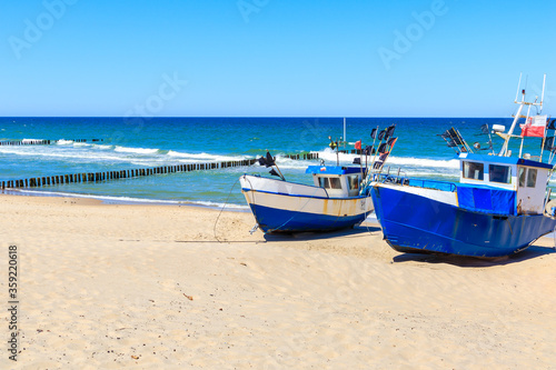 Fishing boats on sandy beach in Chlopy village port  Baltic Sea coast  Poland