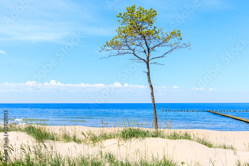 Beautiful white sand beach and blue sea in Darlowko village, Baltic Sea coast, Poland