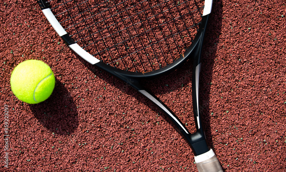 Tennis racket and ball on the professional tennis court, sport concept