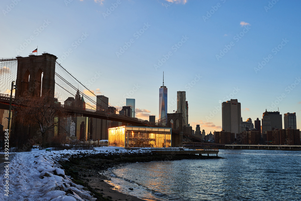 Sunset- East River- Brooklyn Bridge- Carousel- Tower- New York City- United States- USA.