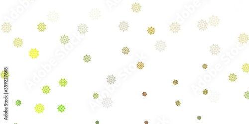 Light green, yellow vector texture with bright snowflakes.