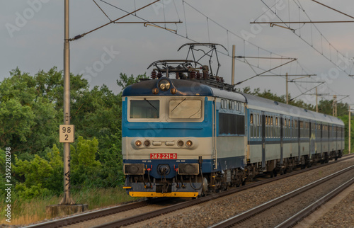 Electric blue engine and coaches on fast railway in south of Moravia © luzkovyvagon.cz