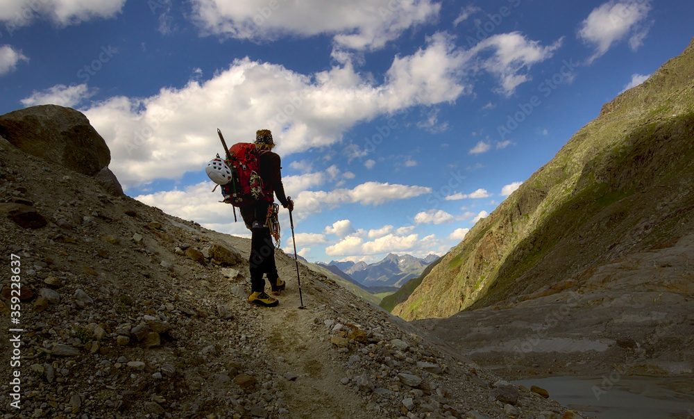 hiker looking into the distance in Pitztal valley, austrain alps