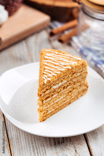 Closeup on sweet dessert slice of honey cake
