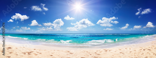 Idyllic Sand Beach With Sun Over Ocean 