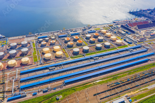 Huge port with oil tanks for storing liquid fuel on the seashore.