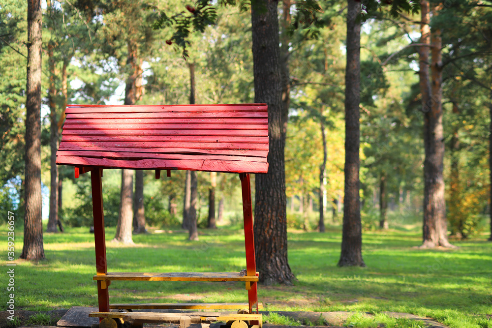 picnic table house in the forest in sunny day