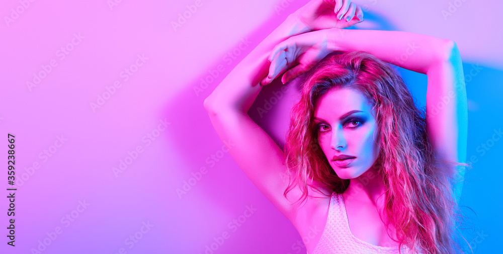 High Fashion. Woman in colorful neon light, make-up. Sexy girl, stylish hair, trendy makeup. Party disco neon style. Creative art beauty portrait, fashionable model face, bright make up High Fashion. Woman in colorful neon light, make-up. Sexy girl, stylish hair, trendy makeup. Party disco neon style. Creative art beauty portrait, fashionable model face, bright make up