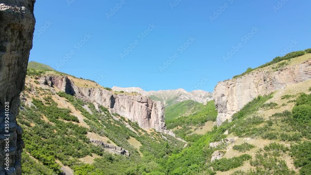 Flying backward and dangerously close to as shear cliff in a rugged canyon wilderness Flying backward and dangerously close to as shear cliff in a rugged canyon wilderness