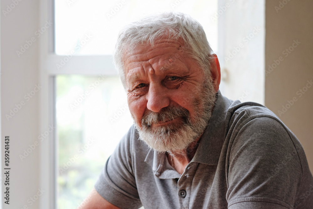 Happy Senior elderly man looking at camera and smiling Happy Senior elderly man looking at camera and smiling