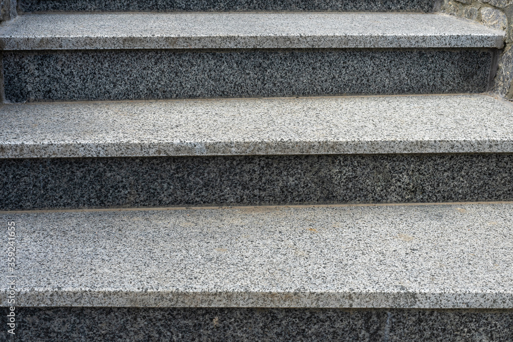 Gray granite stairs. Artificial granite. Three steps