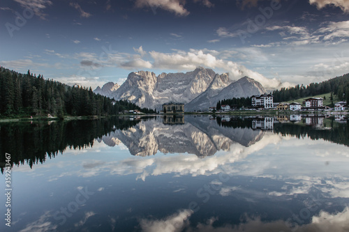 Reflections on the Lake Misurina situated in 1,754 m above sea level. It is one of the most beautiful mountain lakes in the Dolomites,Italy.Scenic view of lake and mountains.Copy space website banner