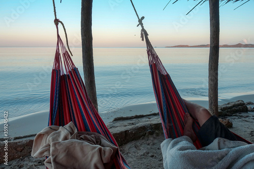 Sleeping in a hammock on Wayuu beach at Cabo de la vela, La guajira, Colombia 
