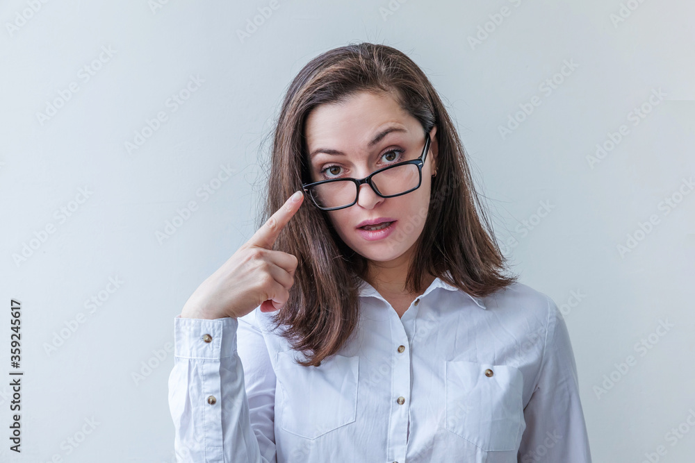 Beautiful happy girl smiling. Beauty simple portrait young smiling brunette woman in eyeglasses isolated on white background. Positive human emotion facial expression body language. Copy space Beautiful happy girl smiling. Beauty simple portrait young smiling brunette woman in eyeglasses isolated on white background. Positive human emotion facial expression body language. Copy space