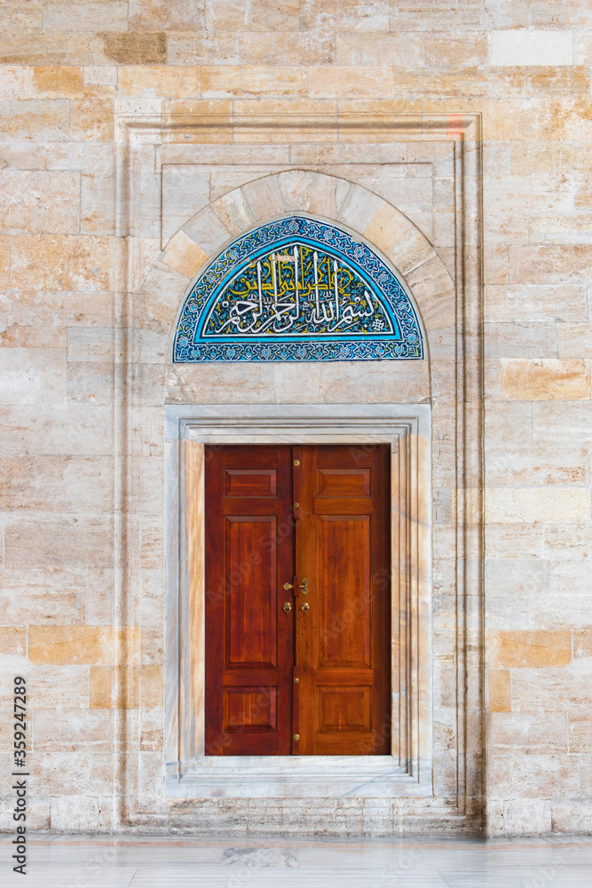 Fatih Mosque. The gate in the Fatih Mosque during the Ottoman Empire. Arabic calligraphy inscription on wooden mosque door