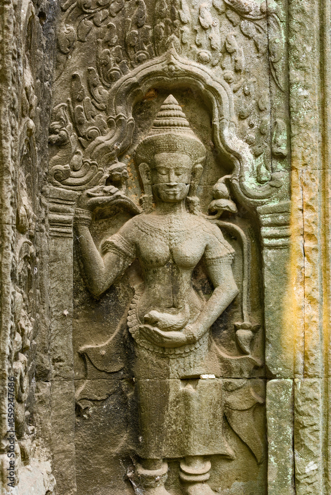 statue of a apsara, a female spirit in the ruins of Ta Prohm temple in siem reap, Cambodia