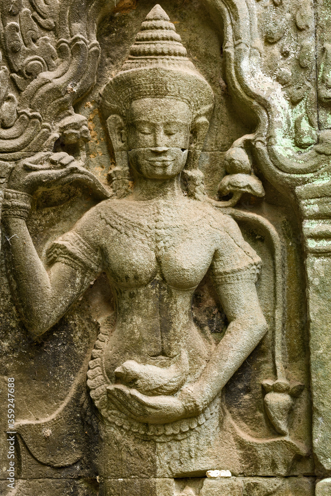 statue of a apsara, a female spirit in the ruins of Ta Prohm temple in siem reap, Cambodia