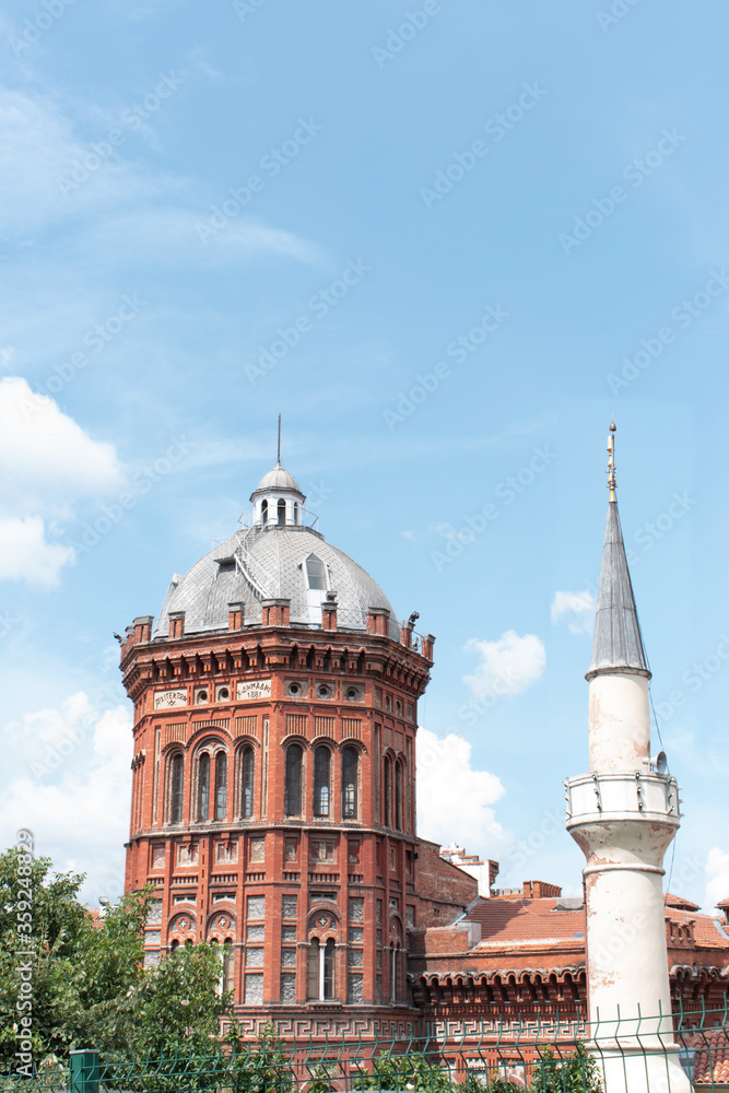 Istanbul, Turkey / August 2019 Bloody church or Saint Mary's Church of the Mongols is an Orthodox chruch in Istanbul. Mosque minaret and church tower next to each other.