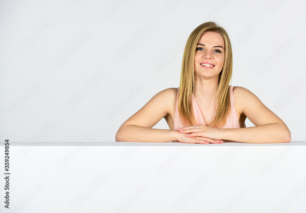 Femininity and tenderness. Lady lean copy space surface. Commercial banner. Goods for female. Beauty shop. Adorable woman stand behind banner. Advertisement marketing and promotion. Portrait of girl Femininity and tenderness. Lady lean copy space surface. Commercial banner. Goods for female. Beauty shop. Adorable woman stand behind banner. Advertisement marketing and promotion. Portrait of girl