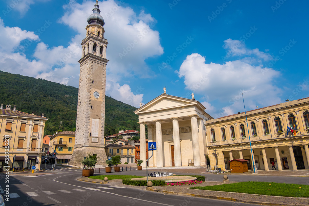 Valdobbiadene, Italy - August 11, 2019: Town Hall and Santa Maria Assunta Cathedral in Piazza Guglielmo Marconi of Valdobbiadene town,Treviso province