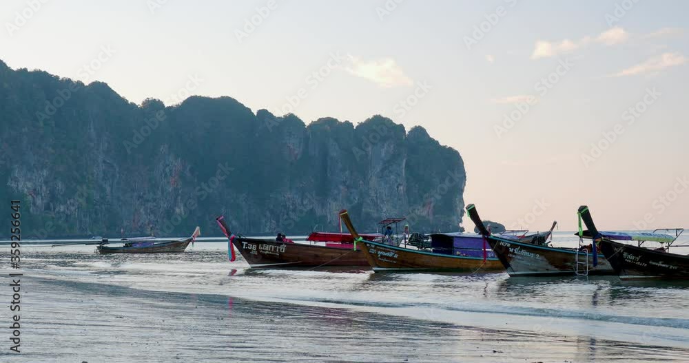 Traditional Thai long-tail boat at sunrise