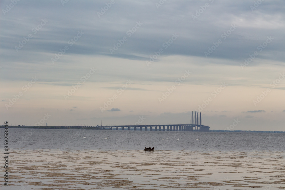 Oresund bridge, which connects Denmark and Sweden and a border between countries. Cloudy day.