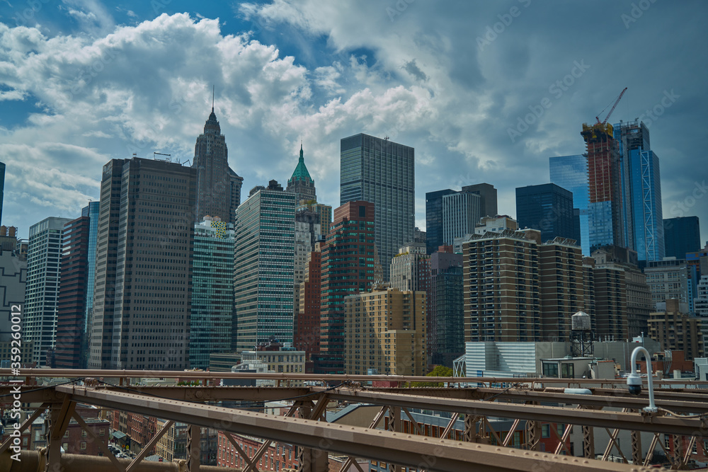 Casual New York City skyscrapers architecture and streets view in lights and glitters in the USA on hot summer day, Manhattan, Brooklyn, Times Square, subway, Brooklyn Bridge