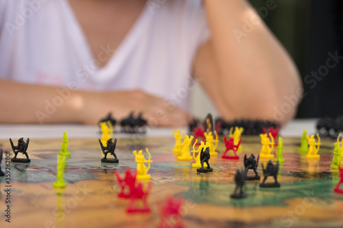 Board game concept, Woman thinking about the game on a blurred background