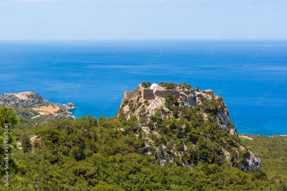 The castle of Monolithos located at the summit of the tall rock. Rhodes island, Greece
