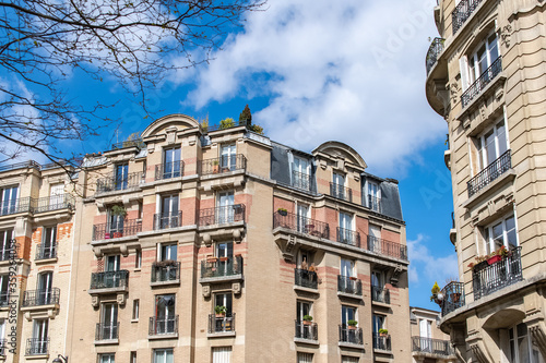Paris, beautiful building in Montmartre, with typical orange brick on the facade 