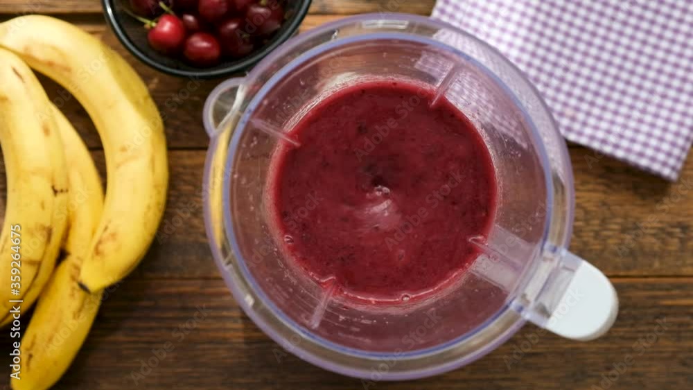 Superfood Acai Smoothie In Blender. Slow Motion Mixing Raw Berry Smoothie. Clean Eating Dieting Concept, Cooking Healthy Food At Home Superfood Acai Smoothie In Blender. Slow Motion Mixing Raw Berry Smoothie. Clean Eating Dieting Concept, Cooking Healthy Food At Home
