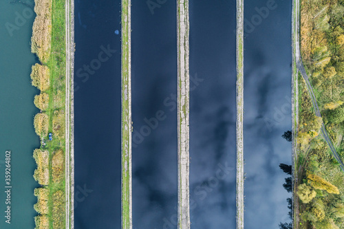 Abstract sendimentation tank of ironworks water treatment plant in Silesia Poland aerial drone view photo