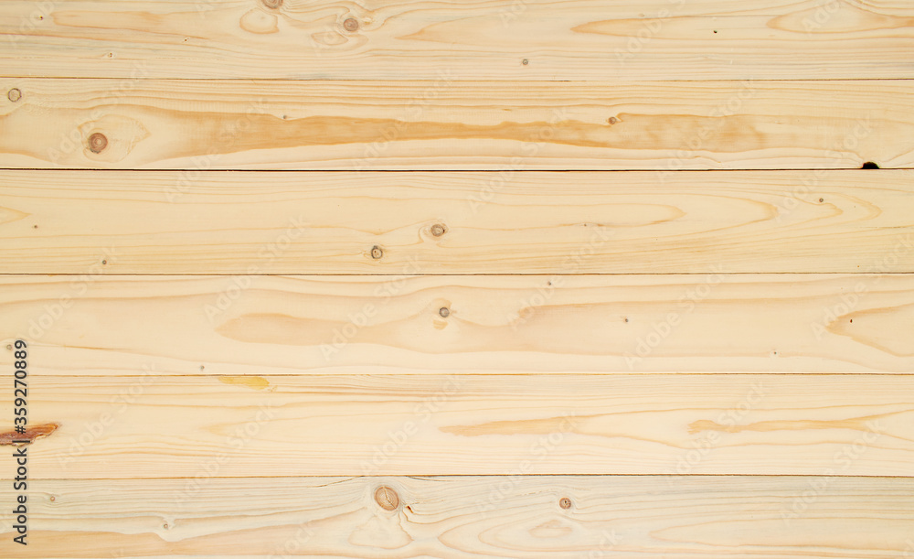 Light brown wooden plank background. Wood with veined patterned wood. Natural wood texture. Light brown wooden plank background. Wood with veined patterned wood. Natural wood texture.