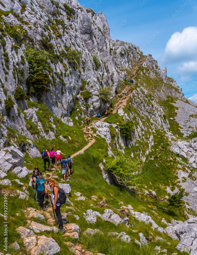 Mount Aizkorri 1523 meters, the highest in Guipuzcoa. Basque Country. A group of friends climbing to the top. Ascent through San Adrian and return through the Oltza fields