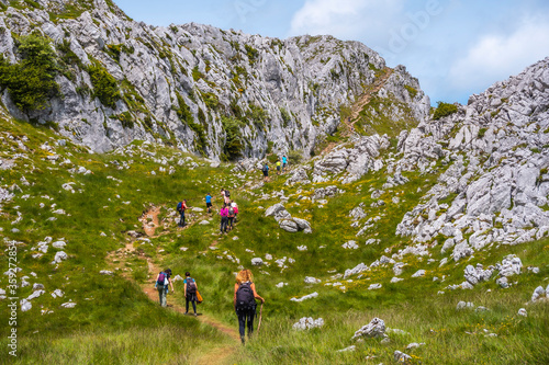 Mount Aizkorri 1523 meters, the highest in Guipuzcoa. Basque Country. A group climbing to the top. Ascent through San Adrian and return through the Oltza fields photo