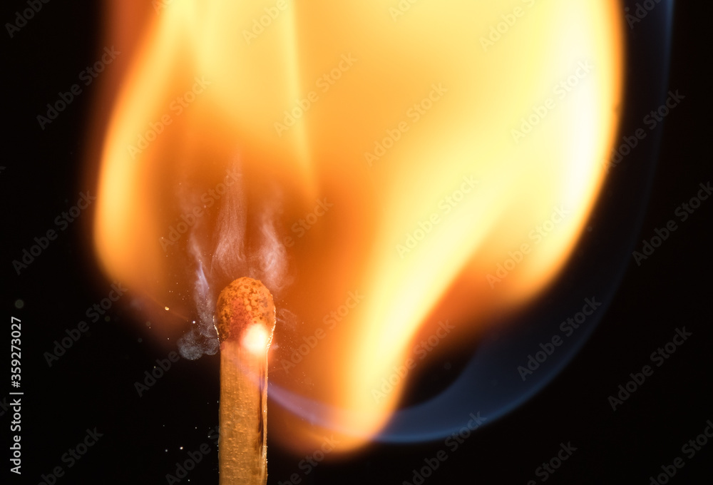 Flash of flame on a match. Close-up. Macro photography. Flash of flame on a match. Close-up. Macro photography.