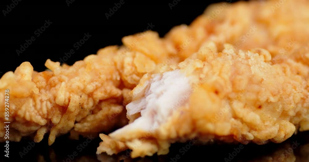 Pieces of chicken strips on the table slowly rotates. Pieces of chicken strips on the table slowly rotates.